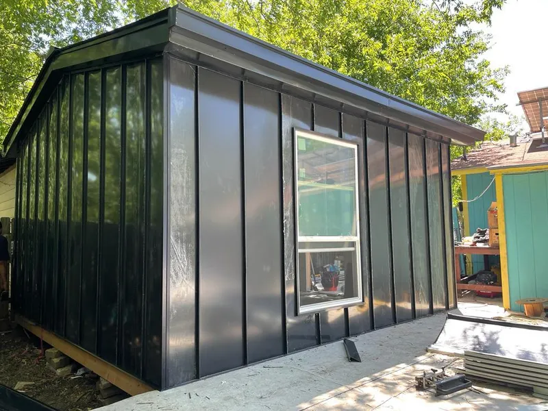 Black standing seam metal wall panels for Roof Inspection in Dacula